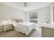 Comfortable bedroom with a double bed, nightstands and ceiling fan at 3624 Muirfield Ct, New Port Richey, FL 34655