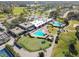 Aerial view of community pool and surrounding landscape at 3624 Muirfield Ct, New Port Richey, FL 34655