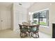 Cozy kitchen nook with a round table and four chairs, perfect for small meals at 3624 Muirfield Ct, New Port Richey, FL 34655