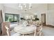 Spacious dining area with table and chairs, access to patio at 3624 Muirfield Ct, New Port Richey, FL 34655
