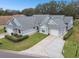 Two-unit house with gray exterior and two car garage at 3624 Muirfield Ct, New Port Richey, FL 34655