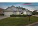 Gray house with two car garage and well-manicured lawn at 3624 Muirfield Ct, New Port Richey, FL 34655