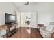 Gathering room with built-in entertainment center and hardwood floors at 3624 Muirfield Ct, New Port Richey, FL 34655