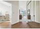 Bright hallway with mirrored closet and views into living room and bedroom at 3624 Muirfield Ct, New Port Richey, FL 34655