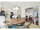 Kitchen with breakfast nook and view into living room at 3624 Muirfield Ct, New Port Richey, FL 34655