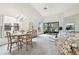 Open living and dining space with vaulted ceilings at 3624 Muirfield Ct, New Port Richey, FL 34655