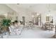 Open living room with floral sofa and large mirror at 3624 Muirfield Ct, New Port Richey, FL 34655