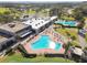 Aerial view of kidney-shaped pool and clubhouse at 3624 Muirfield Ct, New Port Richey, FL 34655