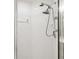 Clean shower with tile surround and handheld shower head at 3624 Muirfield Ct, New Port Richey, FL 34655