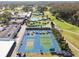 Community tennis and pickleball courts with pool view at 3624 Muirfield Ct, New Port Richey, FL 34655