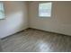 Spacious bedroom with new flooring and large windows at 364 3Rd Nw St, Largo, FL 33770