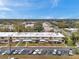 Aerial view showing apartment buildings and surrounding landscape at 4001 58Th N St # 26C, St Petersburg, FL 33709