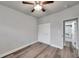 Bright bedroom with wood-look floors and double door closet at 4001 58Th N St # 26C, St Petersburg, FL 33709
