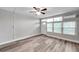Bright living room featuring wood-look floors and a view of the exterior at 4001 58Th N St # 26C, St Petersburg, FL 33709