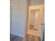 Bright hallway with wood-look flooring and access to rooms at 405 Laguna Mill Dr, Ruskin, FL 33570