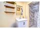 Small bathroom with a white vanity and gray tile shower at 4147 Huntington Ne St, St Petersburg, FL 33703