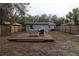 Backyard features a raised wooden deck perfect for relaxing at 438 E Martin Luther King Jr Dr, Tarpon Springs, FL 34688