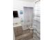 Updated bathroom with a vanity, shower, and striped shower curtain at 438 E Martin Luther King Jr Dr, Tarpon Springs, FL 34688