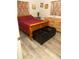 Bedroom with wooden bed frame and dresser at 438 E Martin Luther King Jr Dr, Tarpon Springs, FL 34688