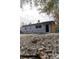 Charming single story home with gray exterior and small yard at 438 E Martin Luther King Jr Dr, Tarpon Springs, FL 34688