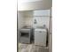 Laundry room features a washer and dryer with shelving at 438 E Martin Luther King Jr Dr, Tarpon Springs, FL 34688