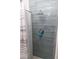 Clean shower with gray tile and a new shower head at 438 E Martin Luther King Jr Dr, Tarpon Springs, FL 34688