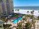 Aerial view of luxurious beachfront condos and pool at 470 Mandalay Ave # 305, Clearwater Beach, FL 33767