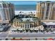 Aerial view of beachfront condo building with ocean and city views at 470 Mandalay Ave # 305, Clearwater Beach, FL 33767