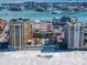 Aerial view of luxurious beachfront condo complex with pool at 470 Mandalay Ave # 305, Clearwater Beach, FL 33767