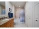 Guest bathroom with tub shower combination, granite vanity at 470 Mandalay Ave # 305, Clearwater Beach, FL 33767
