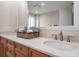 Modern bathroom with double vanity and a large mirror at 470 Mandalay Ave # 305, Clearwater Beach, FL 33767