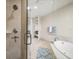 Bathroom with a glass enclosed shower and a view into the bedroom at 470 Mandalay Ave # 305, Clearwater Beach, FL 33767