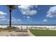 Oceanfront patio with lounge chairs and stunning beach view at 470 Mandalay Ave # 305, Clearwater Beach, FL 33767