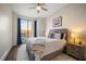 Comfortable bedroom with a queen-size bed and access to a balcony at 470 Mandalay Ave # 305, Clearwater Beach, FL 33767