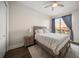 Bedroom with queen bed, nightstand and ceiling fan at 470 Mandalay Ave # 305, Clearwater Beach, FL 33767