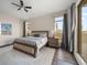 Bright bedroom with king bed, hardwood floors, and plenty of natural light at 470 Mandalay Ave # 305, Clearwater Beach, FL 33767