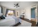 Comfortable bedroom with king bed, hardwood floors, and en-suite bathroom access at 470 Mandalay Ave # 305, Clearwater Beach, FL 33767