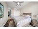 Bedroom with queen bed, nightstand and ceiling fan at 470 Mandalay Ave # 305, Clearwater Beach, FL 33767