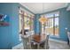 Charming dining area with a table for four and plenty of natural light at 470 Mandalay Ave # 305, Clearwater Beach, FL 33767