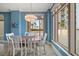Bright dining room with table and chairs, offering stunning water views at 470 Mandalay Ave # 305, Clearwater Beach, FL 33767