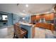 Spacious kitchen with granite countertops, wood cabinets, and stainless steel appliances at 470 Mandalay Ave # 305, Clearwater Beach, FL 33767