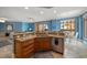 Well-equipped kitchen with an island and stainless steel appliances at 470 Mandalay Ave # 305, Clearwater Beach, FL 33767