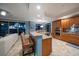 Open kitchen boasting granite island, stainless steel appliances, and a view to the living room at 470 Mandalay Ave # 305, Clearwater Beach, FL 33767