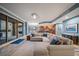 Open concept living room and kitchen with large sectional sofa and water views at 470 Mandalay Ave # 305, Clearwater Beach, FL 33767