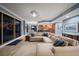 Relaxing living room with sectional sofa and views to balcony and water at 470 Mandalay Ave # 305, Clearwater Beach, FL 33767