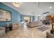 Open living space with beige couches and tile floors at 470 Mandalay Ave # 305, Clearwater Beach, FL 33767