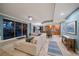 Open concept living area with sectional sofa and access to a relaxing balcony at 470 Mandalay Ave # 305, Clearwater Beach, FL 33767