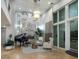 Elegant lobby with fireplace, seating area, and grand piano at 470 Mandalay Ave # 305, Clearwater Beach, FL 33767