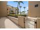 Community patio with lush landscaping and gated access at 470 Mandalay Ave # 305, Clearwater Beach, FL 33767
