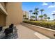 Outdoor patio with seating area and tropical view at 470 Mandalay Ave # 305, Clearwater Beach, FL 33767